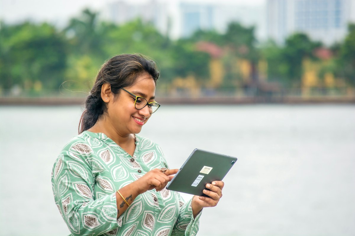 Woman using a tablet outdoors